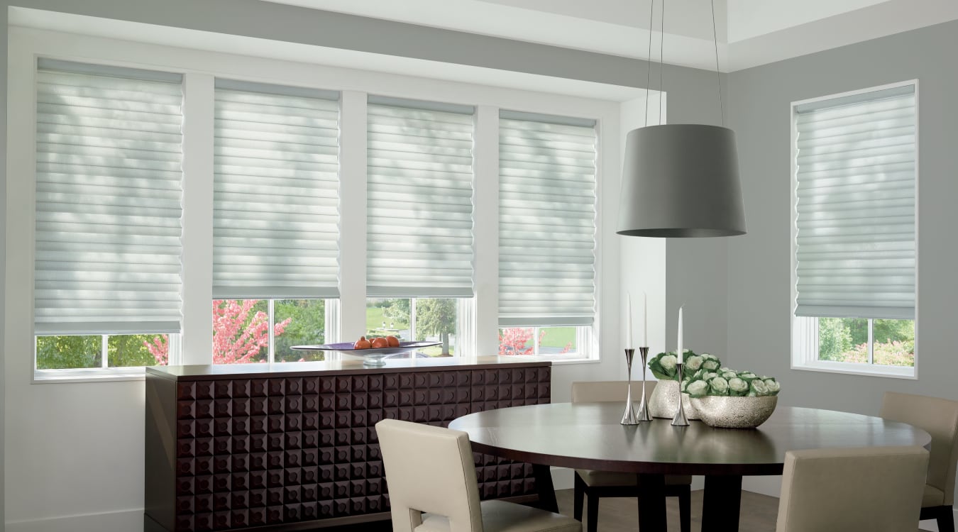 Cordless motorized shades in a Miami dining room